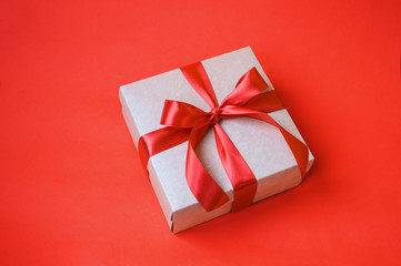 gift on red background with copy space. celebration concept