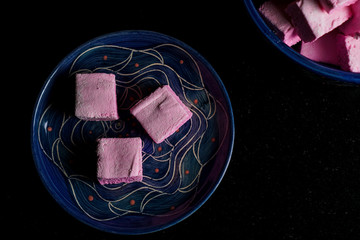 Pink marshmallows on a blue plate