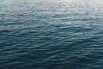 Texture surface of the dark blue sea