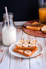 Fresh toast with salted caramel and banana. Delicious breakfast