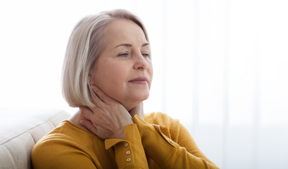 Sore throat woman at home.