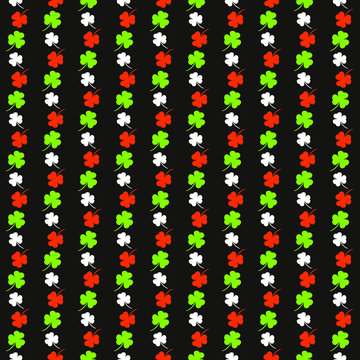 Seamless pattern on the theme of St. Patrick's Day. Black background with white, orange and green shamrocks. Colors of the Irish flag. Pattern for decorating holiday attributes, posters, cards