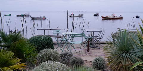 wooden beach terrace in oyster village in oysters bay of arcachon France