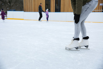girl on skates holding hands on a sore knee