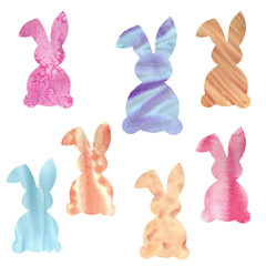 Multi-colored cute fluffy Easter bunnies in the picturesque stains. Watercolor hand drawn illustration