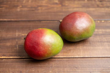 Fototapeta na wymiar Tasty , mango, brown ,table; fruit, food, sweet, healthy, exotic,