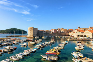Fototapeta na wymiar St John Fortress and sailboats at Old port in Dubrovnik