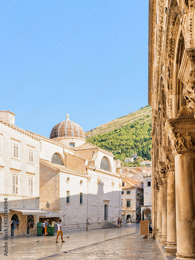 Wall mural people and dubrovnik cathedral in old city