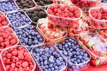 Raspberry blueberry and blackberry in boxes