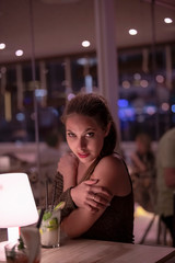 Sensual young woman looks at the camera