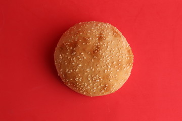 delicious bread rolls on colored background
