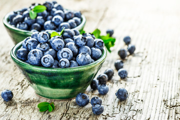 Fresh blueberries background with copy space for your text. Blueberry antioxidant organic superfood in a bowl concept for healthy eating and nutrition