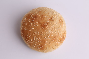 delicious bread rolls on colored background