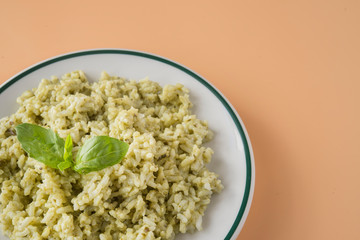 Traditional Mexican Arroz Verde green rice dish made of long-grain rice, spinach, cilantro and garlic