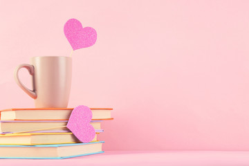 Paper hearts with cup and stack of books on pink background - Powered by Adobe