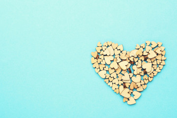 Brown wooden hearts on blue background