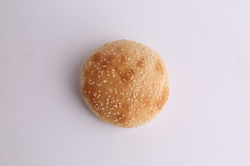 delicious bread rolls on colored background