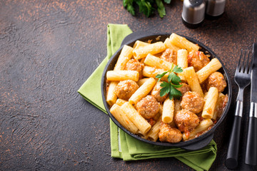 Pasta with meatballs in tomato sauce.