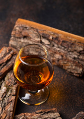 Glass of cognac or whiskey.