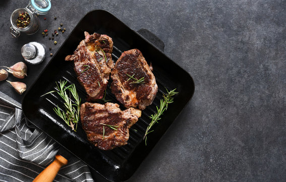 The Process Of Cooking Beef Steak In A Grill Pan With Spices. Grilled Meat. View From Above.