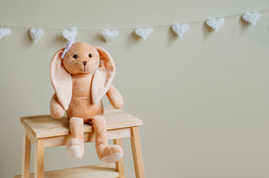 Kids Soft Toy Rabbit With Bow Sitting In Children Room