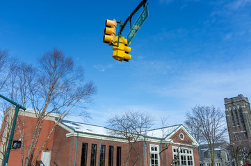 traffic lights against blue sky in winter in North America