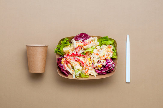 Salad In The Brown Kraft Paper Food Container With Cup And Sticks