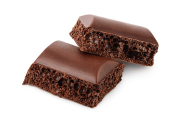 Small dark chocolate pieces isolated on white background with clipping path