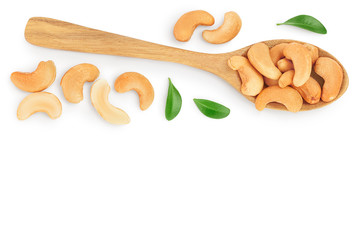 Roasted Cashew nuts in spoon isolated on white background with clipping path and full depth of field. Top view with copy space for your text. Flat lay