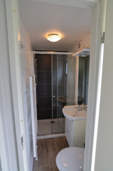 Goes, the netherlands, august 2019. At a campsite a nice white bungalow. The bathroom