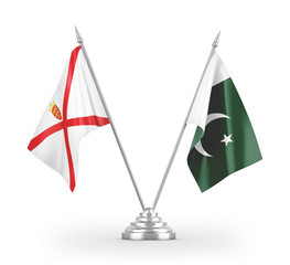 Pakistan and Jersey table flags isolated on white 3D rendering