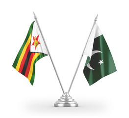 Pakistan and Zimbabwe table flags isolated on white 3D rendering