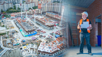 Construction. Man at a construction site. Constructing of a residential area view from above....