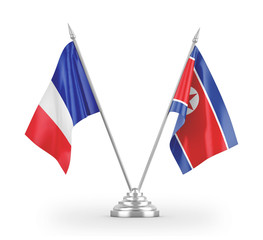 North Korea and France table flags isolated on white 3D rendering