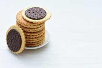 Fototapeta na wymiar Chocolate cookies displayed on light background