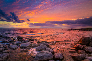 Russia. Corelia. Lake Ladoga during sunset. Landscape of Lake Ladoga. Northern nature of Karelia. Large boulders on the lake. The nature of Russia. Sunset in Karelia. Traveling in Russia.