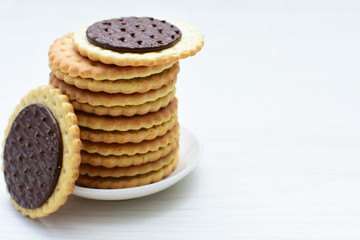  Chocolate cookies displayed on light background