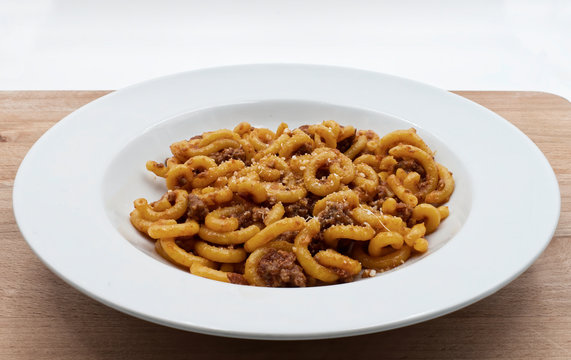 Gramigna pasta. Gramigna with bolognese rag&ugrave; and parmigiano reggiano cheese. Traditional Italian foo