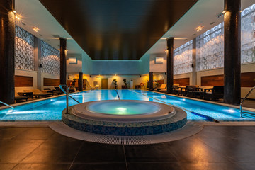 Modern blue on light backdrop. Trendy design. Water - swimming pool. Blue luxurious swimming pool...