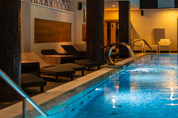 Modern blue on light backdrop. Trendy design. Water - swimming pool. Blue luxurious swimming pool...