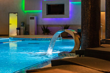 Fototapeta na wymiar Swimming pool for luxury lifestyle design. Water - swimming pool. Luxury lifestyle. Natural pattern, luxury. Blue background. Water sports. Water - swimming pool.