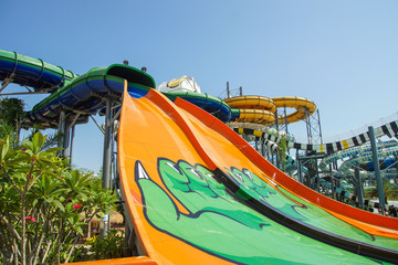 Bottom view of the large slides in the water park in the summer.