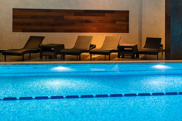 Modern blue on light backdrop. Water - swimming pool. Blue luxurious swimming pool. Swimming pool...