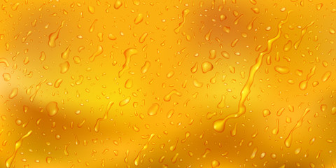 Background with drops and streaks of water in yellow colors, flowing down the surface