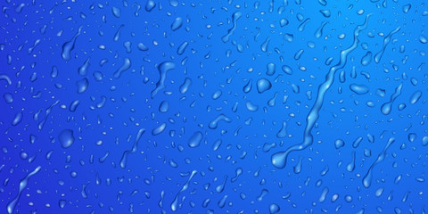 Background with drops and streaks of water in blue colors, flowing down the surface