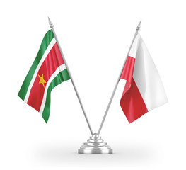 Poland and Suriname table flags isolated on white 3D rendering