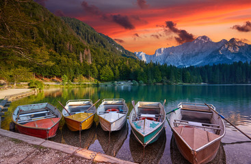 Amazing view on Lago di Fusine Inferiore at sunrise. Splendid morning scene of Julian Alps,...
