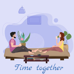 Cute loving couple sitting on bed drinking tea or drinks and eating together at home