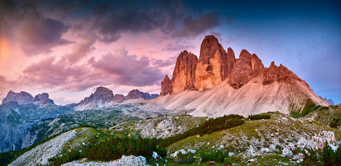 Amazing view of The Three Peaks of Lavaredo (Tre Cime di Lavaredo) at sunset. Trentino Alto Adidge, Dolomites mountains, South Tyrol, Italy, Europe.