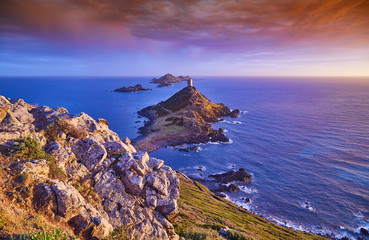 View of Pointe de la Parata on the west coast of Corsica France Europe. A ruined Genoese tower sits...
